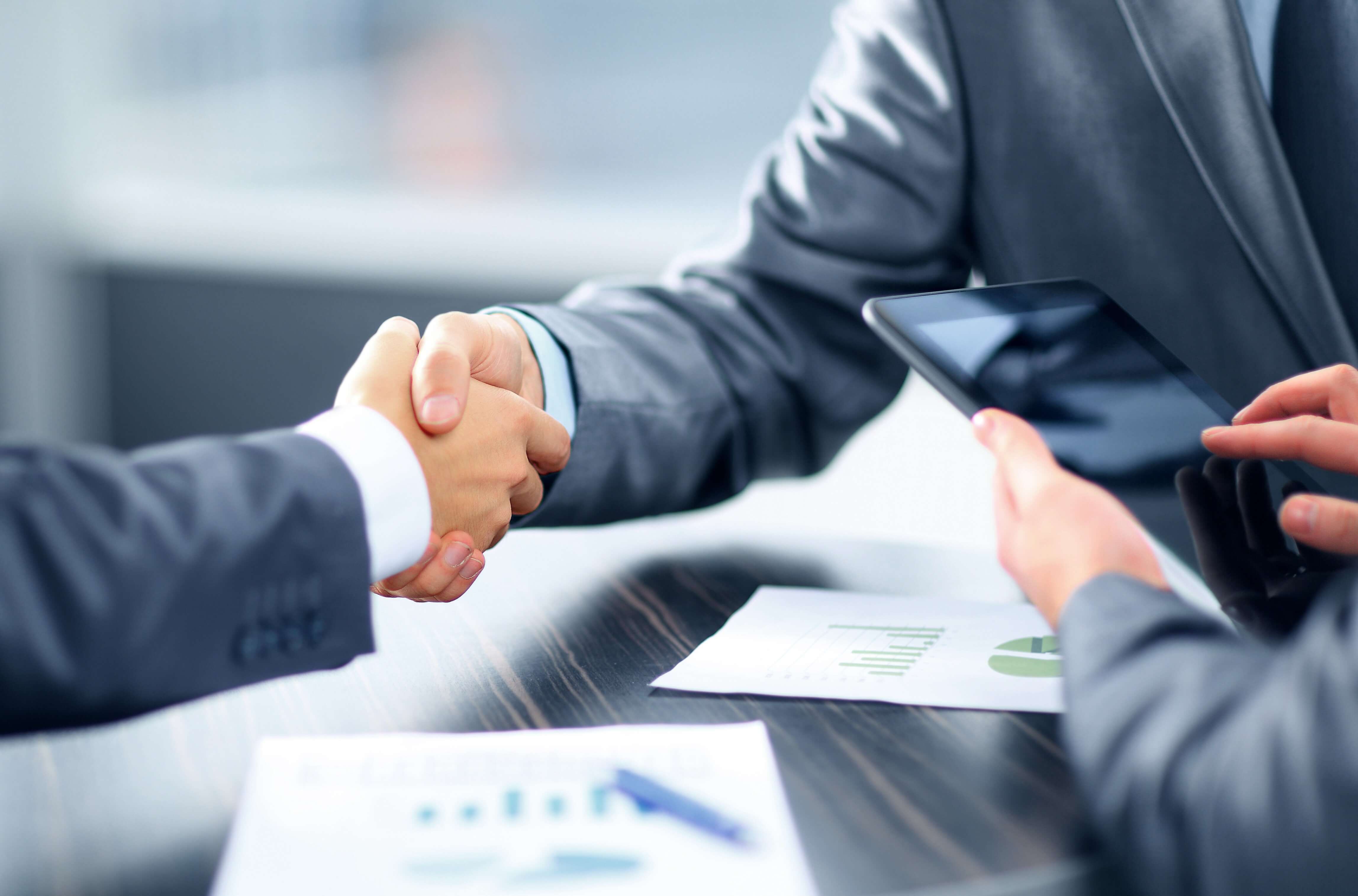 Handshake representing investor and partner meetings